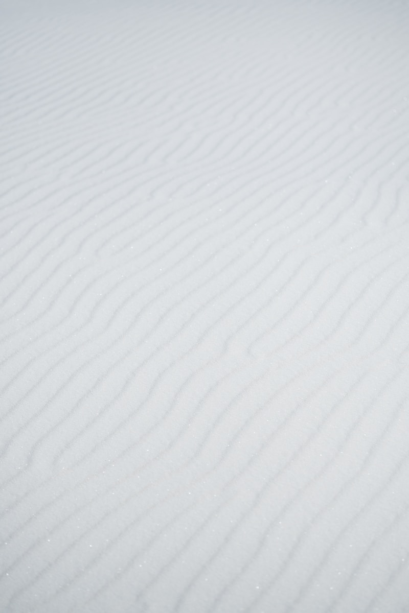 a person riding skis down a snow covered slope